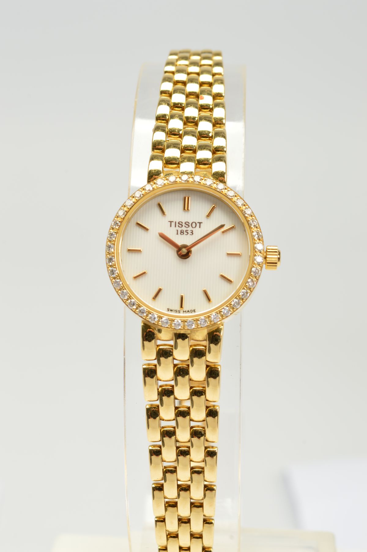 A MODERN 18CT GOLD AND DIAMOND LADIES TISSOT WRISTWATCH, round white dial measuring approximately