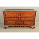 A GEORGE III OAK AND MAHOGANY BANDED LANCASHIRE MULE CHEST, the hinged top above an arrangement of