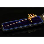 A LATE 18TH TO EARLY 19TH CENTURY GOLD GEM SET SWORD STICKPIN, the hilt with cannetille and beaded