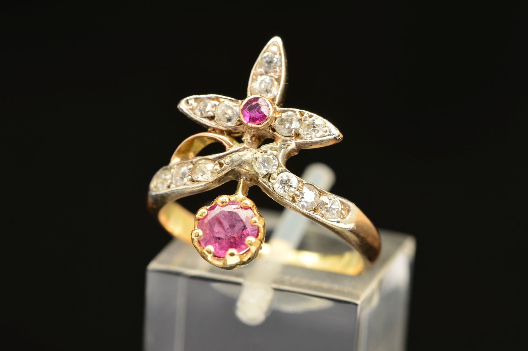 AN EARLY 20TH CENTURY RUBY AND DIAMOND FANCY ABSTRACT RING, a wishbone form supporting foliate - Image 3 of 7