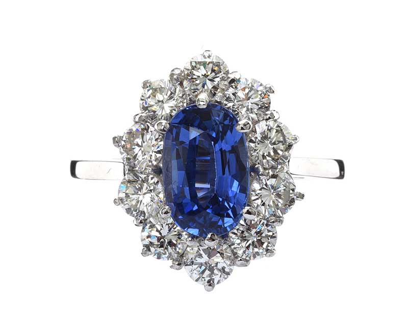 18CT WHITE GOLD SAPPHIRE AND DIAMOND CLUSTER RING