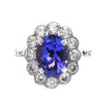 18CT WHITE GOLD TANZANITE AND DIAMOND CLUSTER RING