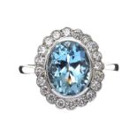 18CT WHITE GOLD AQUAMARINE AND DIAMOND CLUSTER RING