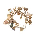 9CT GOLD CHARM BRACELET