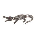 SILVER AND HIGH CARAT GOLD RUBY AND DIAMOND CROCODILE BROOCH