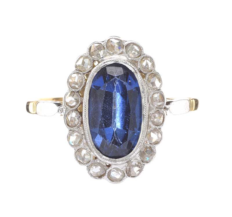 18CT GOLD BLUE GLASS AND DIAMOND RING