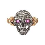 18CT GOLD AND SILVER BACKED DIAMOND AND RUBY SKULL RING