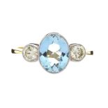 18CT GOLD AQUAMARINE AND DIAMOND RING