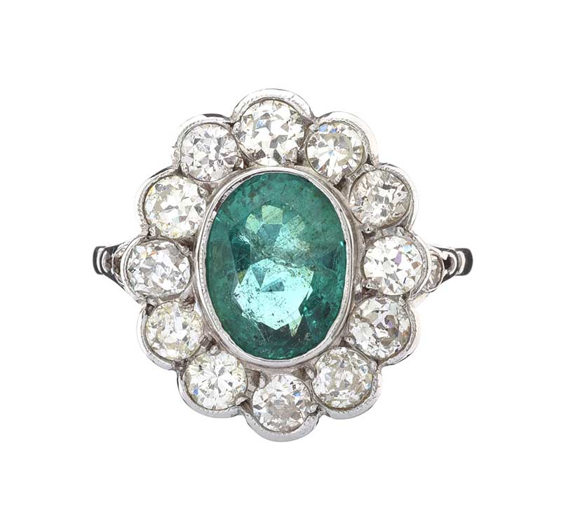 18CT WHITE GOLD EMERALD AND DIAMOND CLUSTER RING