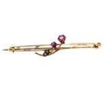 9CT GOLD COLOURED STONE AND SEED PEARL BAR BROOCH MOUNTED WITH A FLORAL SPRAY