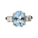 18CT GOLD AQUAMARINE AND DIAMOND RING