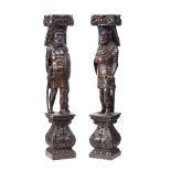 PAIR OF CARVED OAK FIGURES