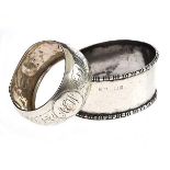 TWO SILVER NAPKIN RINGS