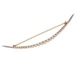 14CT GOLD CRESCENT BROOCH SET WITH SEED PEARLS AND PLATINUM POINTS