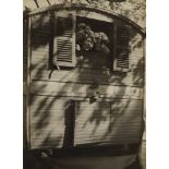 André Kertész, Hungarian 1894-1985- Boys on the back of a caravan, 1926; gelatin silver print, bears