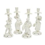 A set of four Stevenson and Hancock white glazed porcelain figural candlesticks, late 19th/early