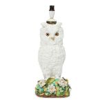 A Victorian porcelain oil lamp base, in the form of an owl, modelled perched on a rock with leaves