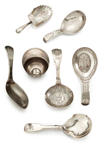 A George III silver jockey cap form caddy spoon, Birmingham c.1799, maker IT, together with six