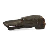 A carved horn walking stick handle in the form of a dog, 19th century, with glass bead eyes, 11cm