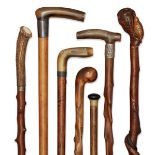 A collection of seven various briar, horn and antler walking canes, early-mid 20th century,