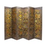 A North German Chinoiserie and painted leather six-fold screen, mid-18th century, each panel painted