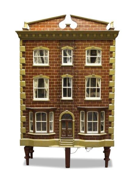 A six room painted wood dolls house, late 19th/early 20th century, the roof with two sections of