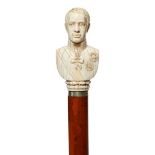 A Continental ivory walking cane, late 19th century, the handle in the form of a military gentleman,