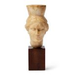 A marble female caryatid head, Greek Hellenistic Period, circa. 1st Century B. C., 12cm high, on a