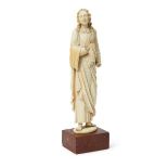 An ivory model of a Saint, probably Italian, early 18th century, the standing figure on a rouge