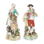 A pair of Chelsea Derby figures of a shepherd and shepherdess, 18th century, he decorated with a