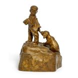 An Austrian bronze ashtray modelled with a boy and puppy, cast after a model by Friedrich Gornik,