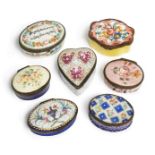 A group of seven enamel patch boxes, late 18th/19th century, five decorated with flower designs, one