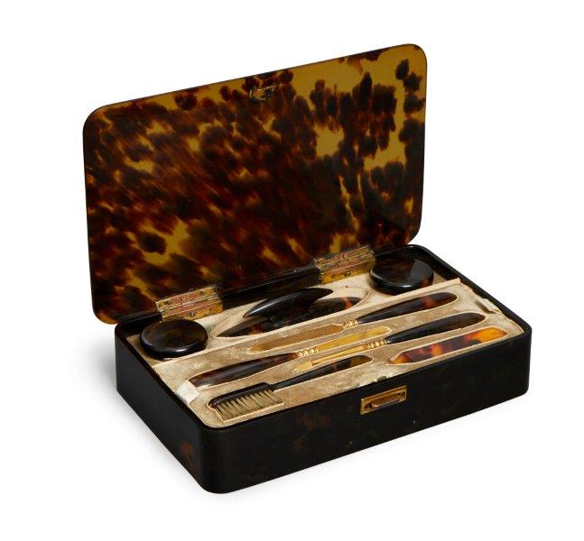 An Asprey tortoiseshell and gilt metal manicure set, late 19th/20th century, the case of rectangular