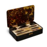 An Asprey tortoiseshell and gilt metal manicure set, late 19th/20th century, the case of rectangular