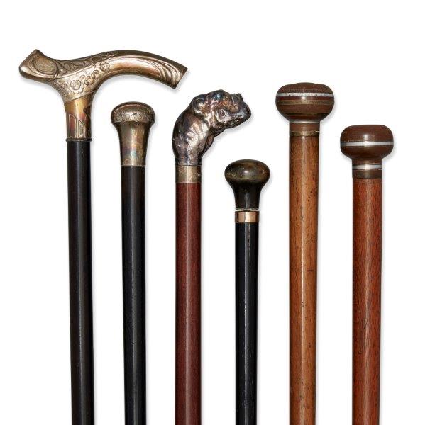 A collection of six various walking canes, late 19th-mid 20th century, comprising: a white metal