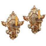 A pair of Italian silvered and giltwood wall appliques, of rococo style, 19th century, each with