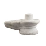 A white marble lingam and yoni, India, 19th century or earlier, carved in one piece with the