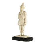 An ivory figure of a Sikh soldier, India, 19th century, on a rectangular ivory base, mounted on a