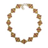 An garnet-set gold bead necklace, South India, 20th century, formed of a series of gold ovoid-shaped