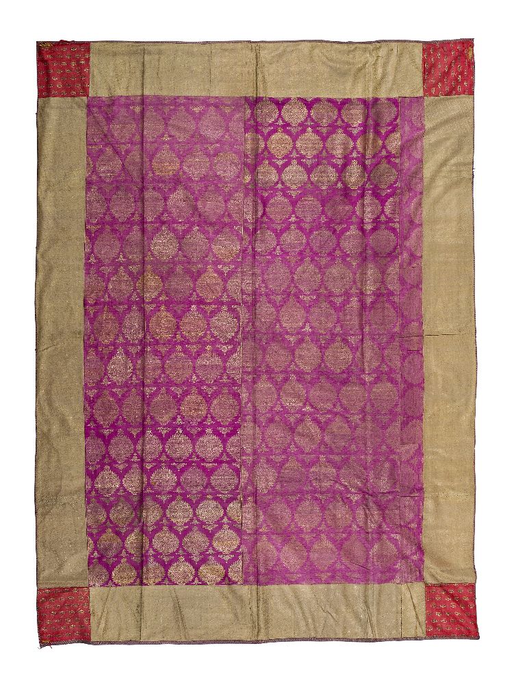 A Mughal gilt metal embroidered silk panel, India, 18th century, of rectangular form, the central