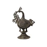 A pierced bronze incense burner in the form of a bird, Deccan, 16th century, the bird with a