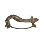 A bronze hilt, Deccan, India, 17th century, the grip in the form of a makara head with a small