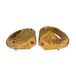A pair of gilded white sheet metal cuff bracelets, Indonesia, late 19th/early 20th century, of