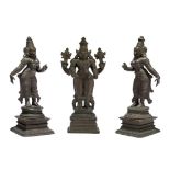 A South Indian bronze triad of Vishnu with Sri Devi and Bhu Devi, Karnataka, 19th century, each on a