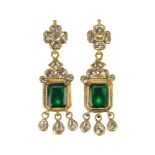 A pair of emerald and diamond-set gold earrings, India, 20th century, the foil-backed emerald of
