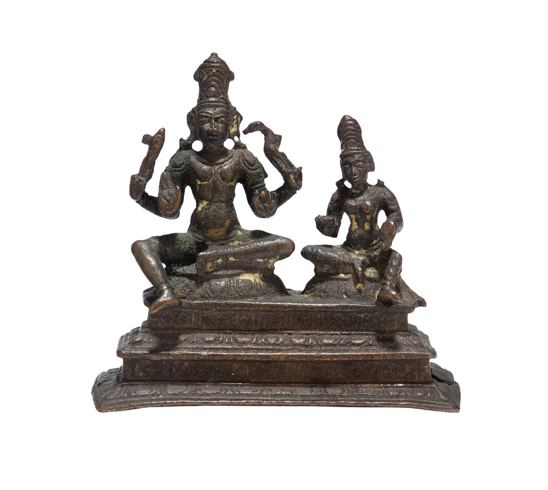 A South Indian figure of Shiva and Parvati Somaskanda, 18th century, on a rectangular tiered base,