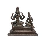 A South Indian figure of Shiva and Parvati Somaskanda, 18th century, on a rectangular tiered base,