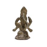 A small bronze figure of Ganesha, 18th century, on a circular base, with flat back, 6cm. high