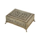 A silver repousse copper box, Tanjore, 19th century, of rectangular form, on four claw feet, the