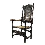 An Indian hardwood chair, in the Charles II style, 19th century, with bird form finials, the back of